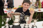 Proudly showing off his four cups won in the domestic section at Gwinear show is Harry Vincent including best pa. | Gwinear Show